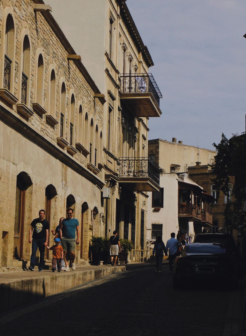 Family walking through an old town on holiday